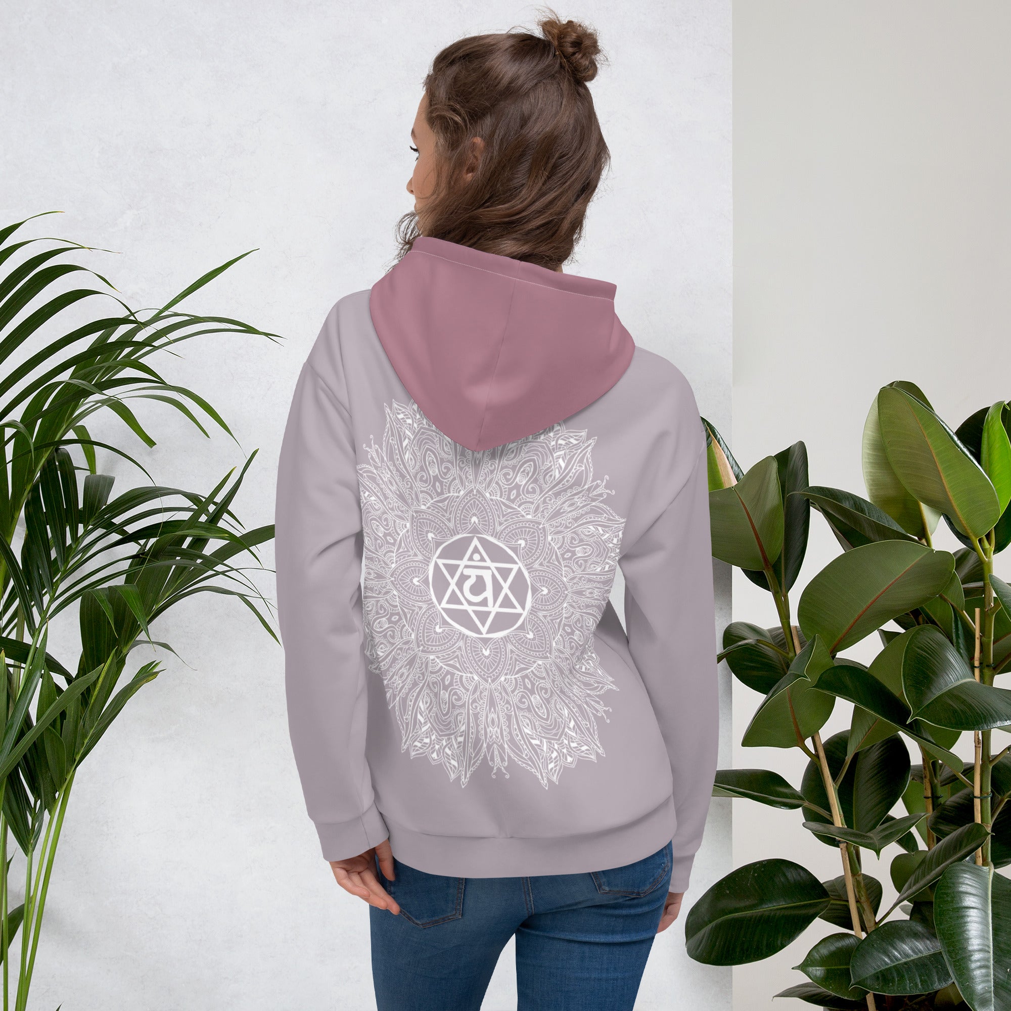 mystic 77 heart chakra mandala hoodie by goddess swag.  design on front is a white mandala.  design on back is a white heart chakra mandala enlarged. The hood is a medium mauve. The background of the hoodie is a solid light mauve.  Hoodie has a pocket pouch in front.